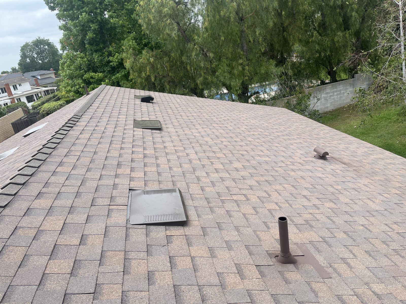 Finished asphalt shingle roof replacement with new ridge vents by NRG Roofing in Ventura County