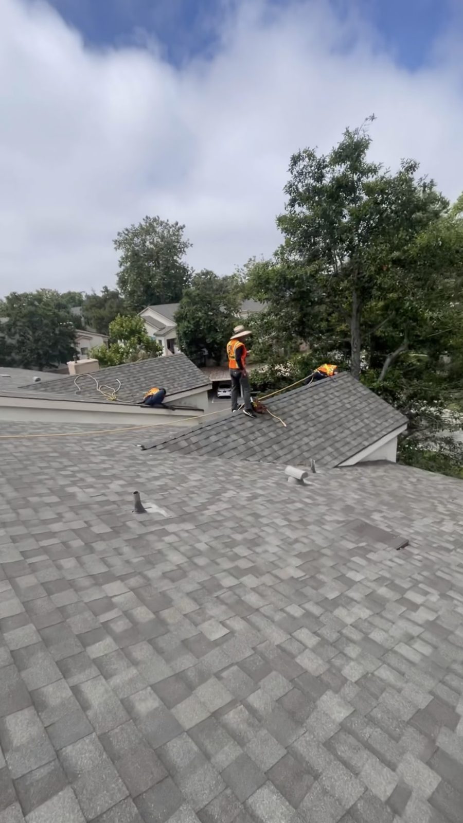 NRG Roofing crew re-roofing a condominium complex with architectural shingles in Ventura County