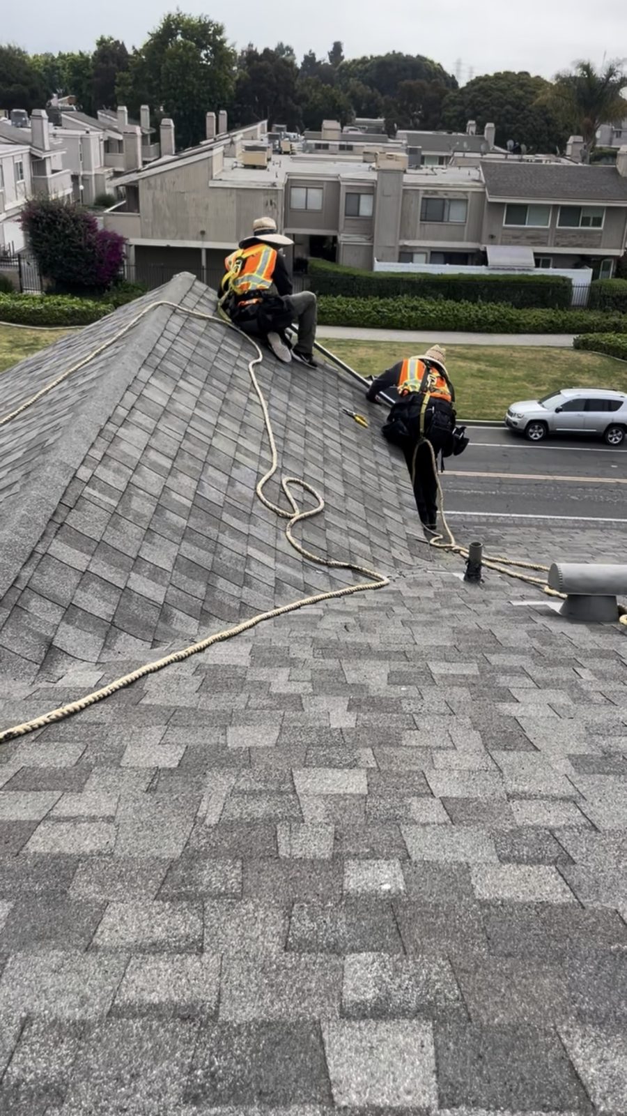 NRG roofer installing architectural shingles on a multifamily condo roof in Ventura County