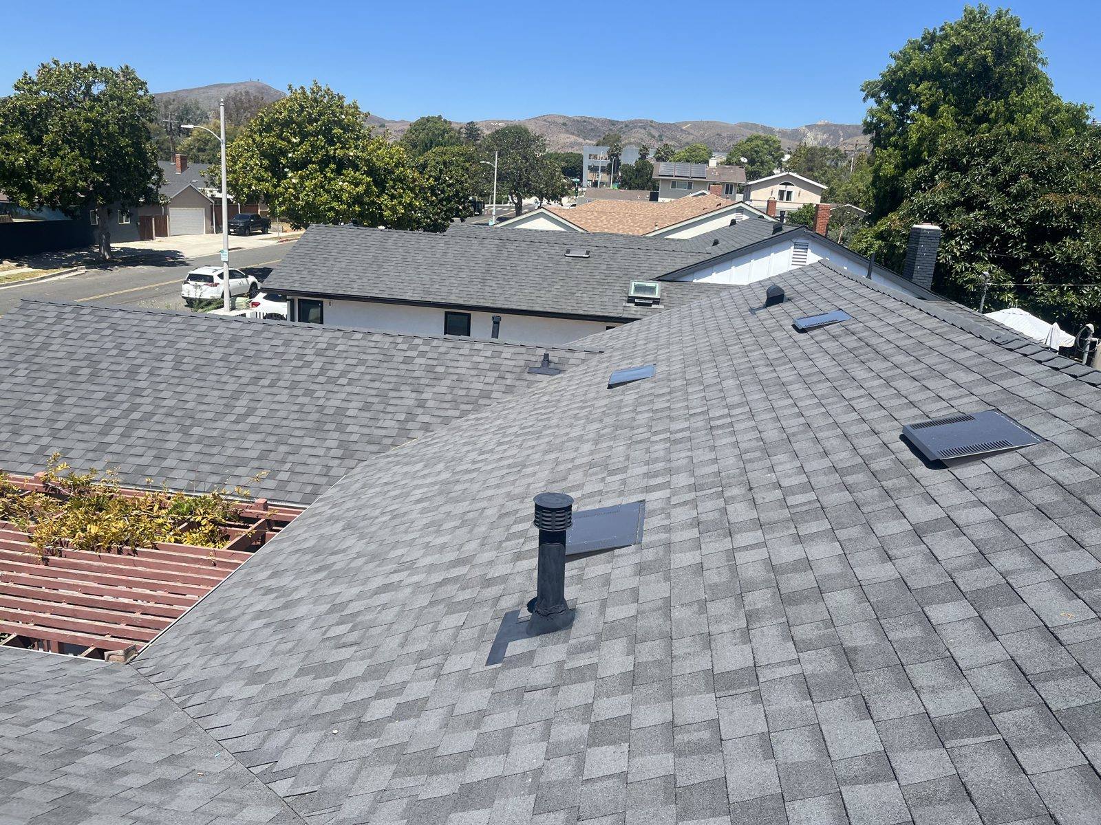 Completed CertainTeed Landmark Solaris shingle re-roof in Moire Black by NRG Roofing in Ventura