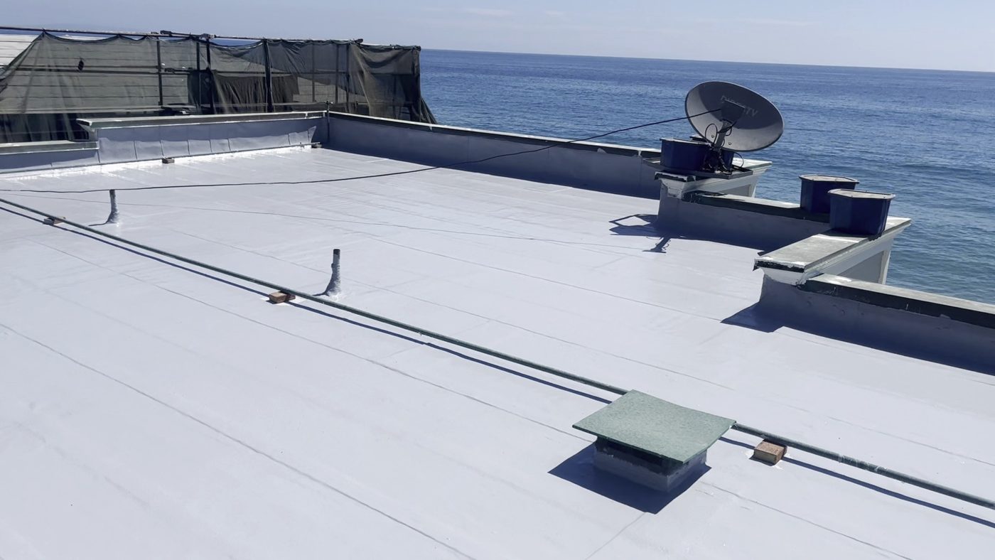 Completed silicone-coated flat roof with ocean view, Malibu, by NRG Roofing