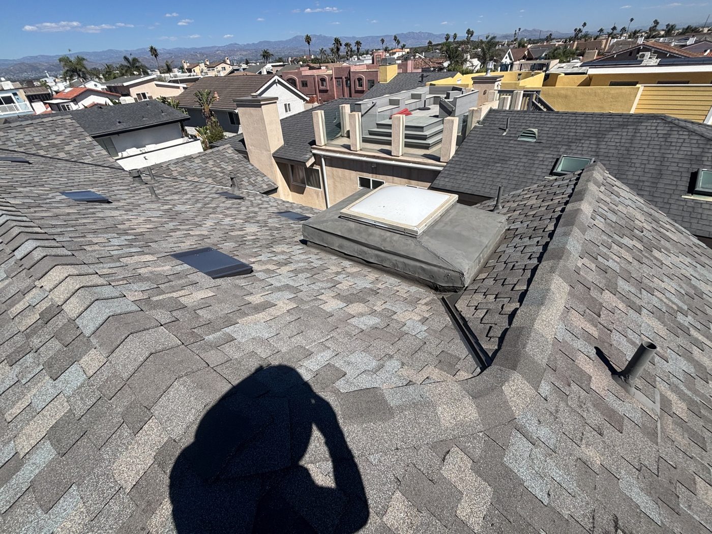 Completed architectural shingle re-roof, wide view, Oxnard beach home by NRG Roofing