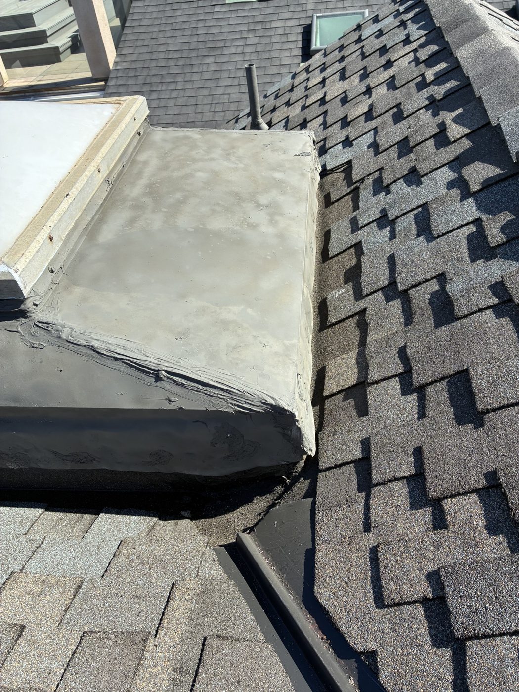 Custom-fabricated skylight flashing finished on an Oxnard re-roof by NRG Roofing