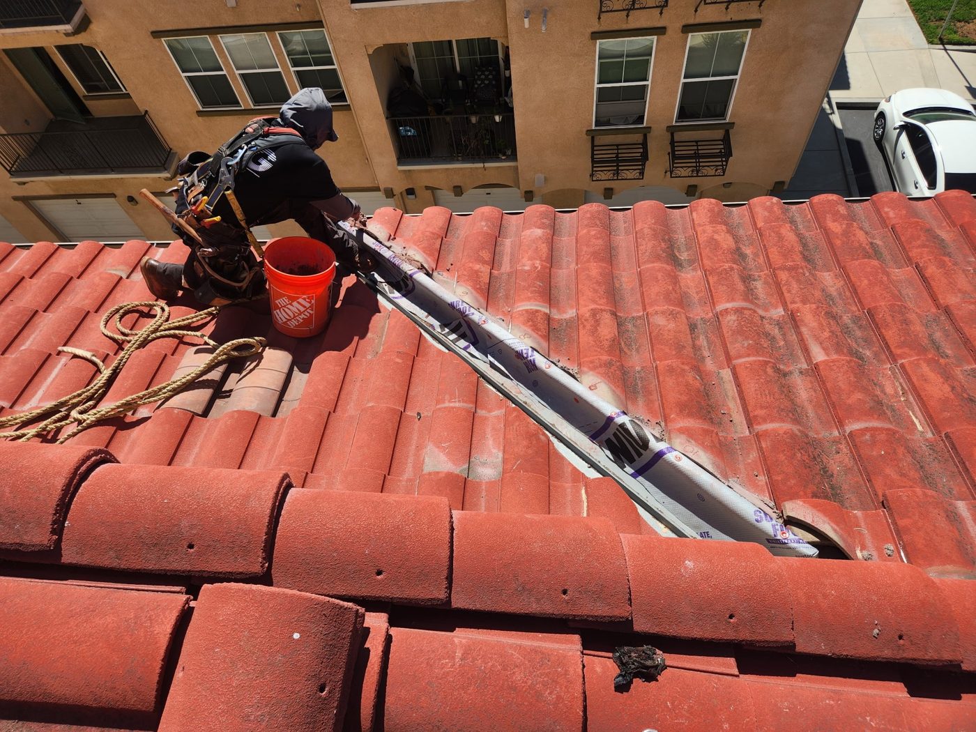 Tile roof section reset over new underlayment at an Oxnard condo community by NRG Roofing