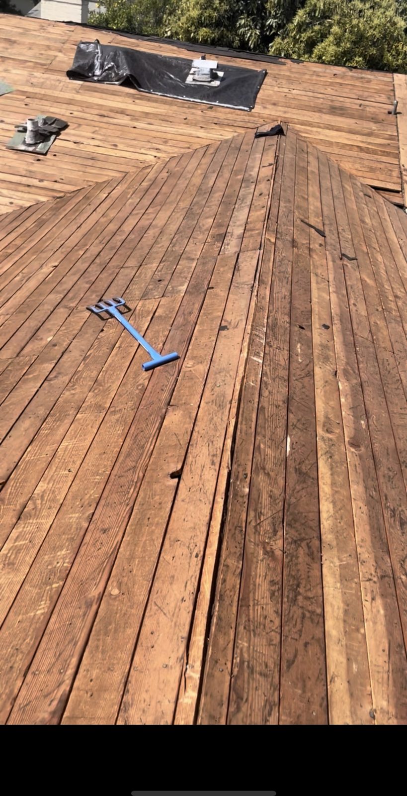 Roof tear-off down to plank decking during a re-roof by NRG Roofing in Ventura County