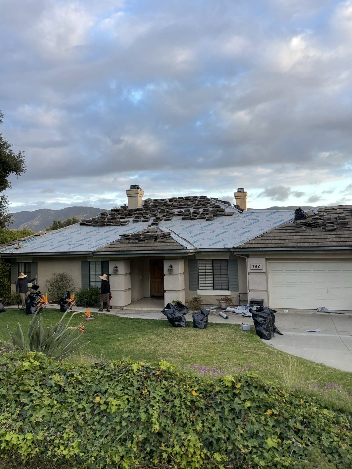 Tile roof relay with new underlayment in progress by NRG Roofing in Ventura County