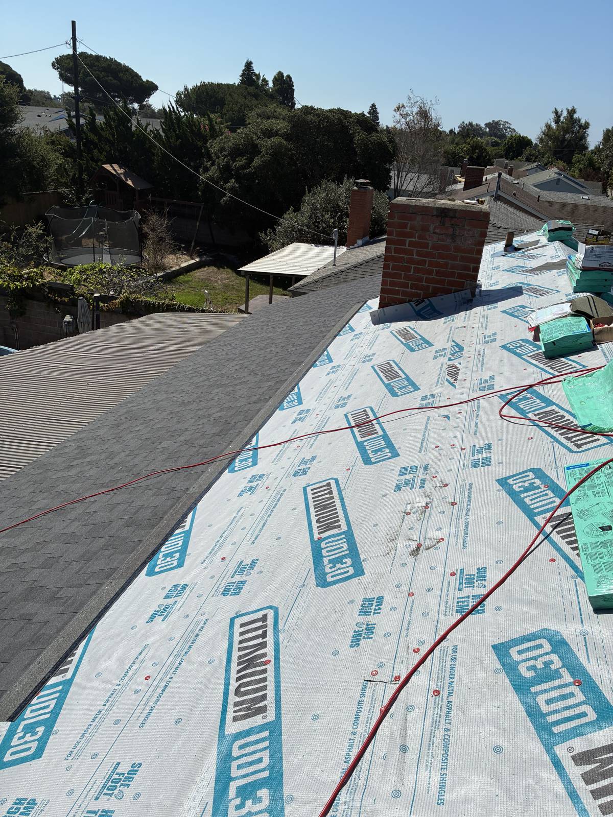 Synthetic underlayment dry-in with the first shingle courses by NRG Roofing in Ventura