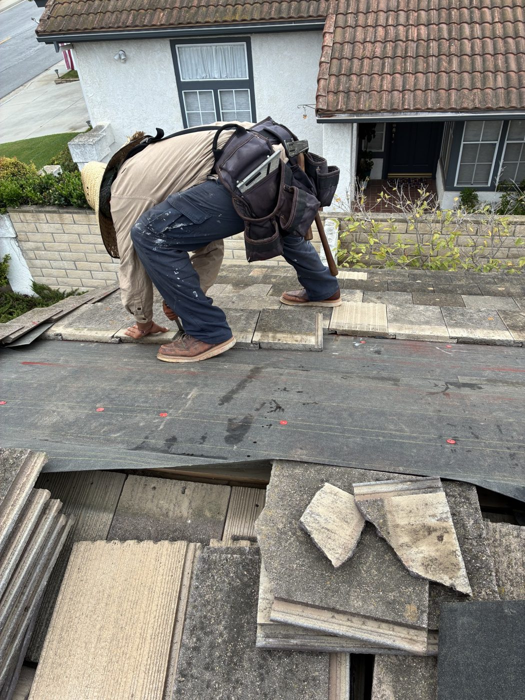 Cracked roof tiles culled for replacement at the eave during a tile repair in Ventura by NRG Roofing