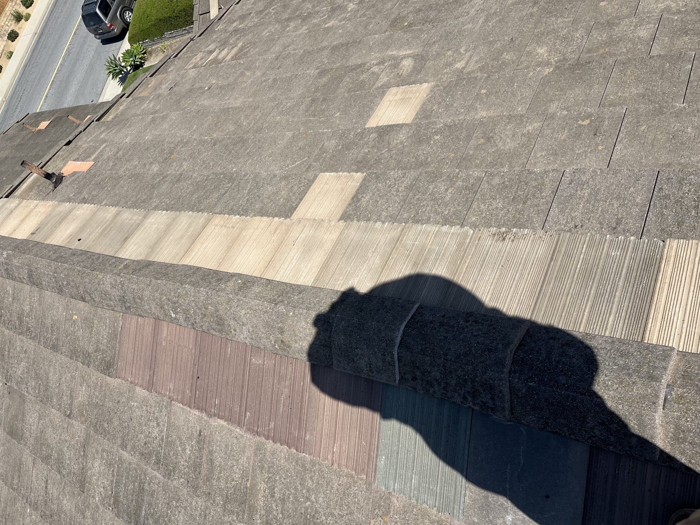 Hip cap tiles reset with matching replacement tile, Ventura tile roof repair by NRG Roofing